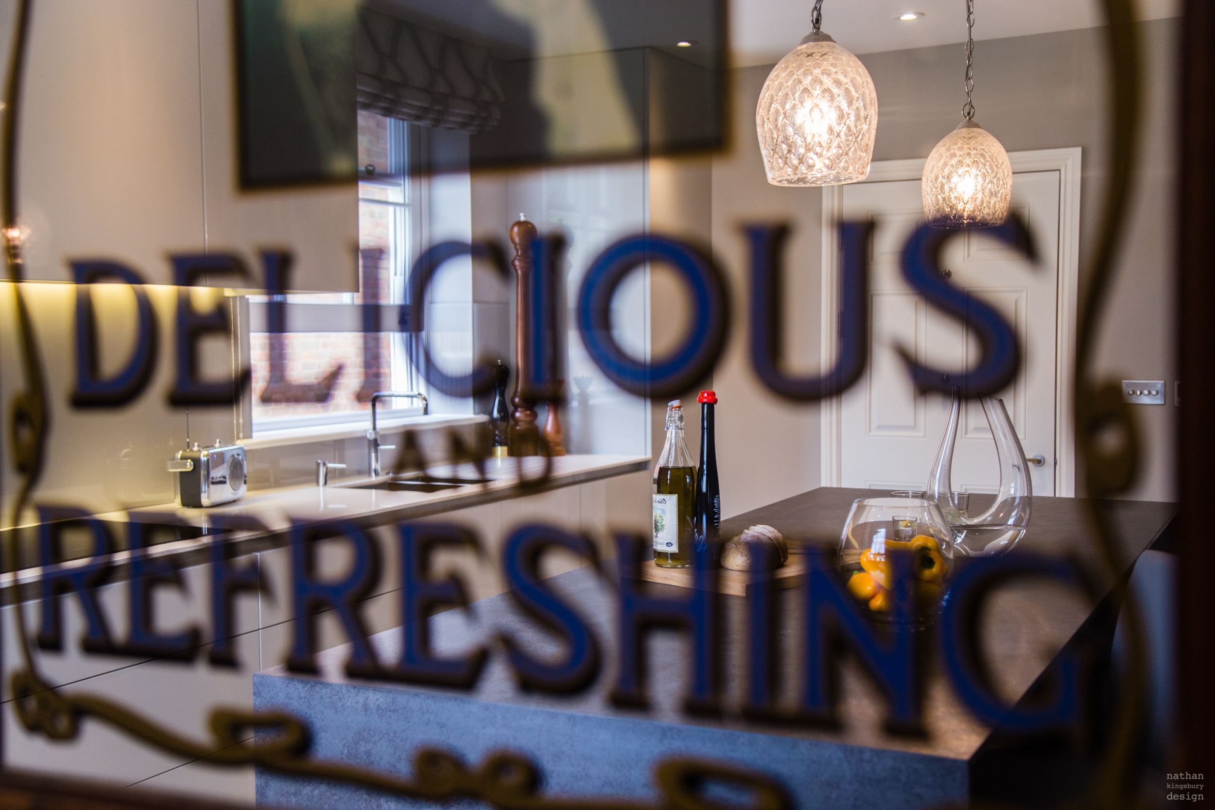 reflection in mirror of custom made kitchen reigate surrey