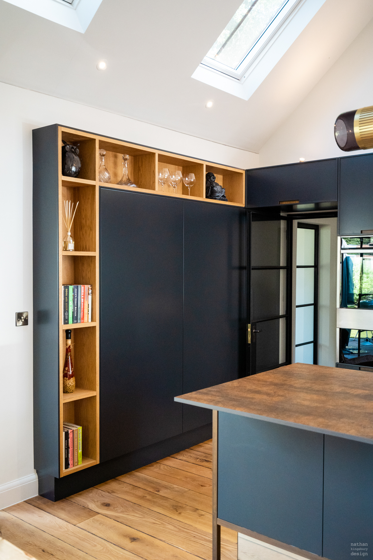 dark bespoke kitchen cabinets and oak shelves reigate surrey