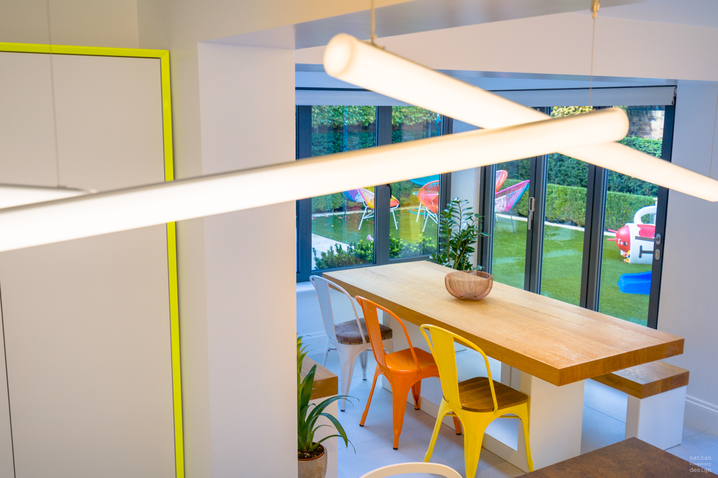 linear interior lighting design with bespoke kitchen table clapham south london