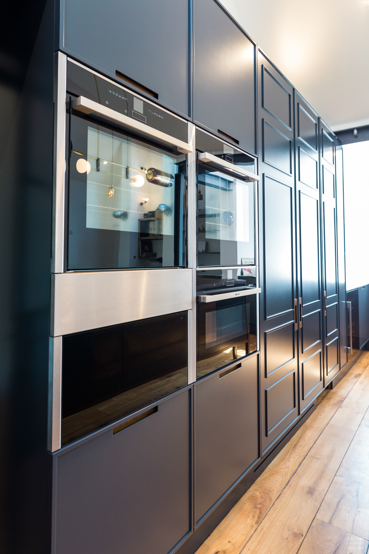bespoke dark kitchen cabinets with integrated ovens reigate surrey