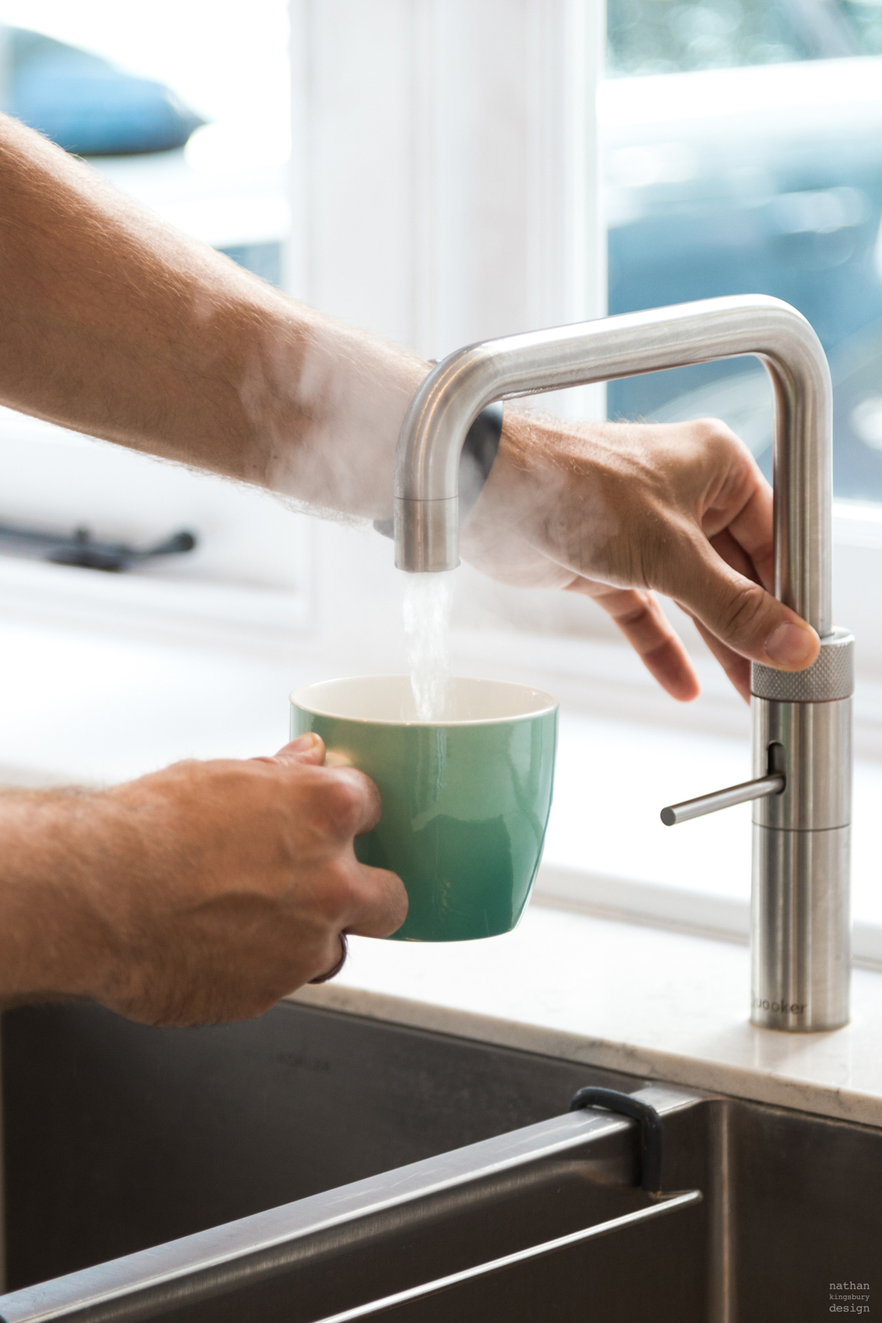 man working bespoke kitchen quooker hot tap reigate surrey